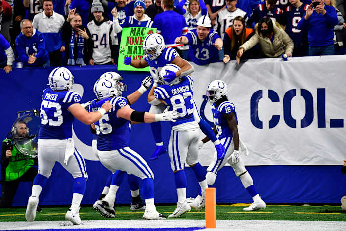 Dec 18, 2021; Indianapolis, Indiana, USA; Indianapolis Colts running back Jonathan Taylor (28) celebrates a run for a 69 yard touchdown during the second half against the New England Patriots at Lucas Oil Stadium. Colts won 27-17. Mandatory Credit: Marc Lebryk-USA TODAY Sports